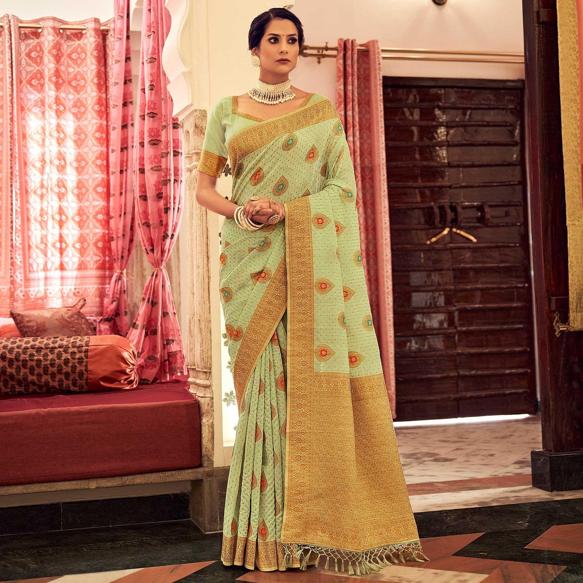 green-festive-wear-woven-banarasi-saree-with-tassels-142421