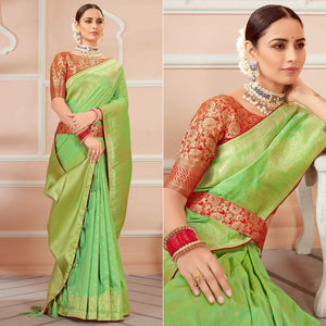 green-festive-wear-woven-banarasi-silk-saree-with-tassels-138446