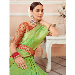 green-festive-wear-woven-banarasi-silk-saree-with-tassels-138446