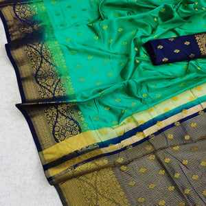green-festive-wear-woven-cotton-silk-saree-129714