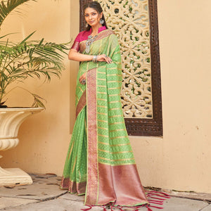 green-festive-wear-woven-organza-saree-with-tassels-141565