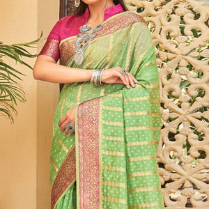 green-festive-wear-woven-organza-saree-with-tassels-141565