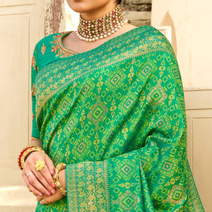 green-festive-wear-woven-silk-saree-135395