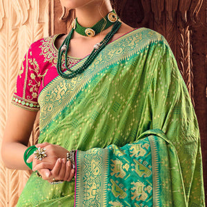 green-festive-wear-woven-silk-saree-130732