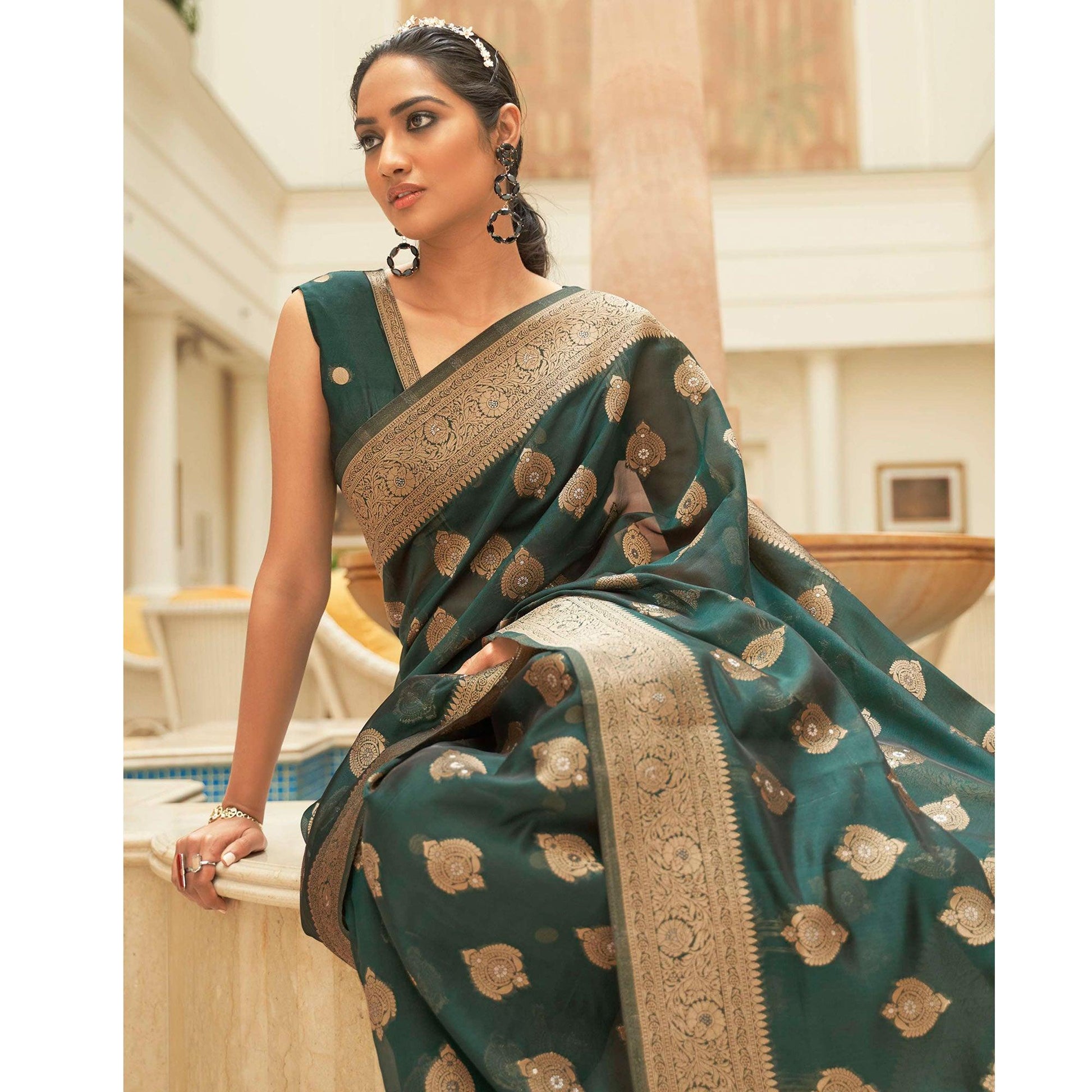 green-festive-wear-zari-woven-organza-silk-saree-with-tassels-137612