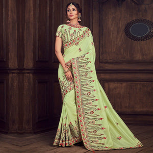 green-party-wear-heavy-embroidered-silk-saree-141326
