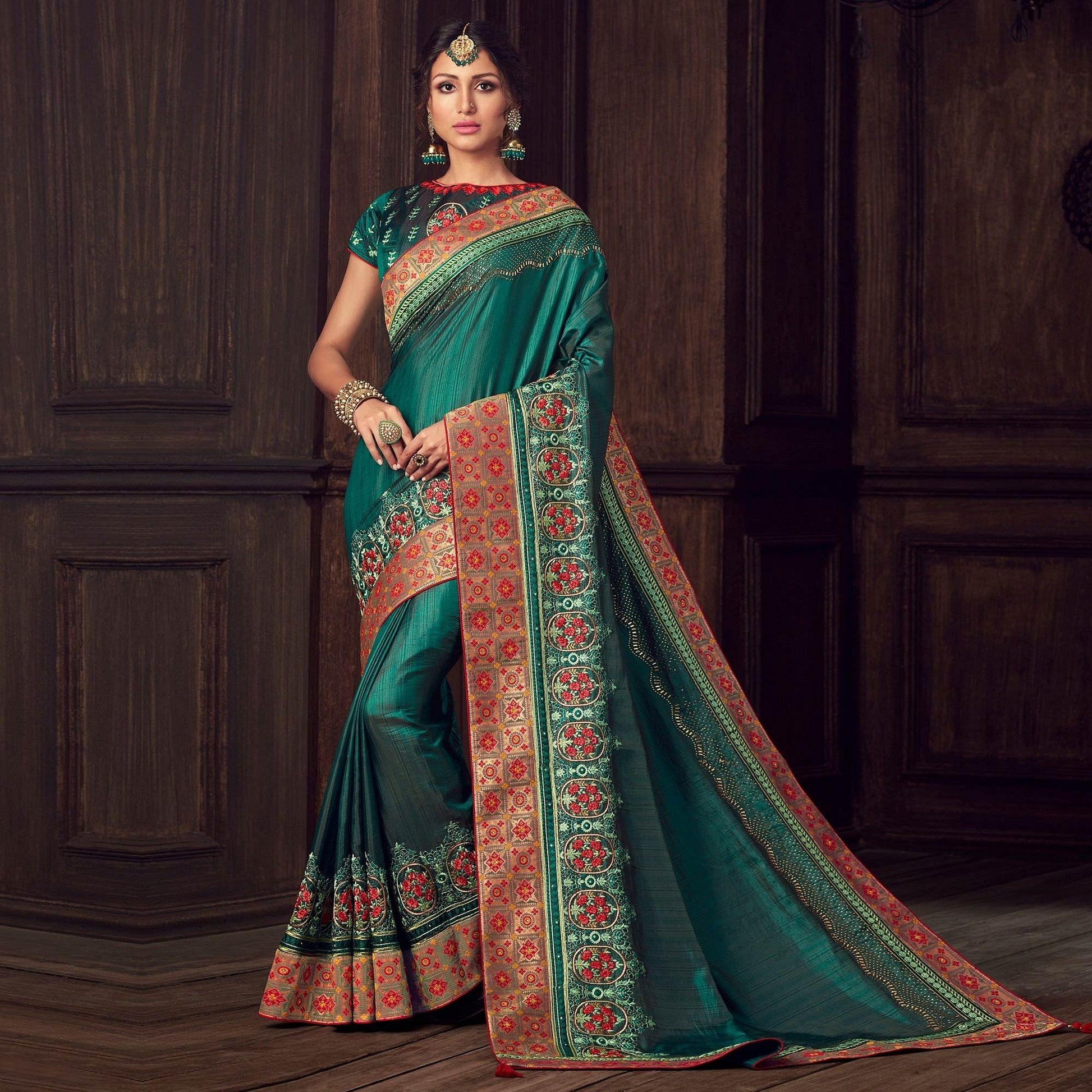 green-party-wear-heavy-embroidered-silk-saree-141328