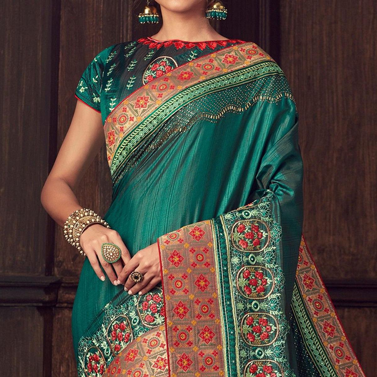 green-party-wear-heavy-embroidered-silk-saree-141328