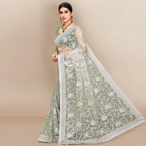 green-partywear-floral-embroidered-soft-net-saree-129763
