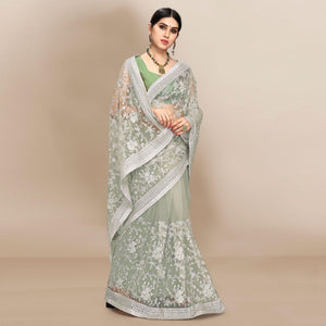 green-partywear-floral-embroidered-soft-net-saree-129763