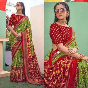 green-patola-printed-silk-saree-with-tassels-145577