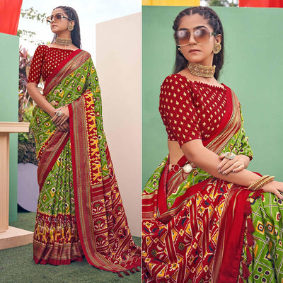 green-patola-printed-silk-saree-with-tassels-145577