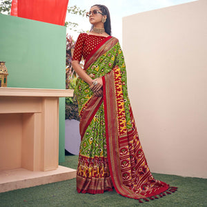 green-patola-printed-silk-saree-with-tassels-145577