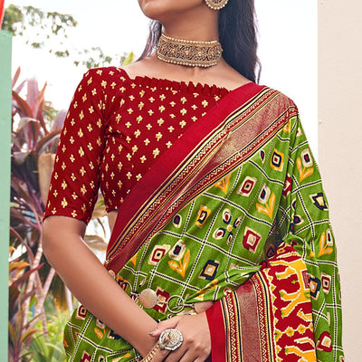 green-patola-printed-silk-saree-with-tassels-145577
