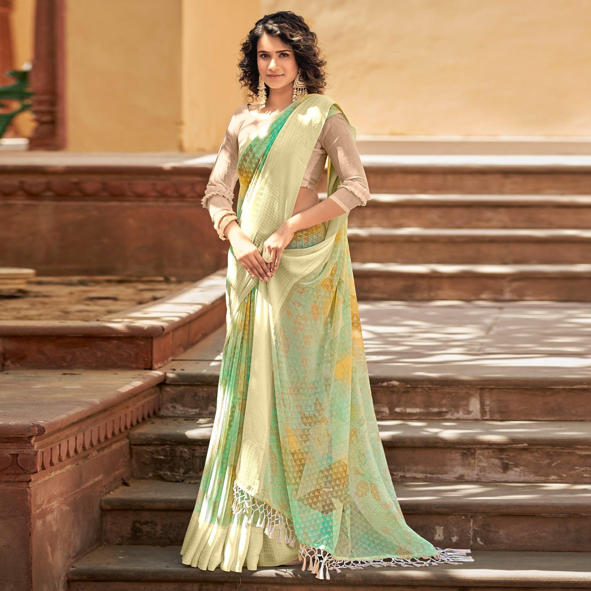 green-printed-georgette-saree-with-tassels