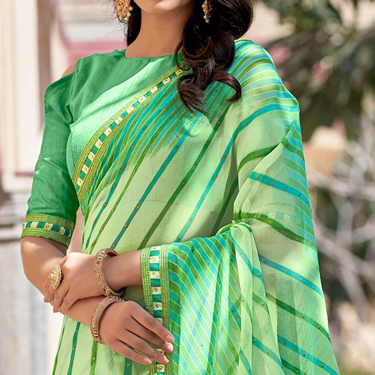 green-printed-with-embellished-georgette-saree-143510