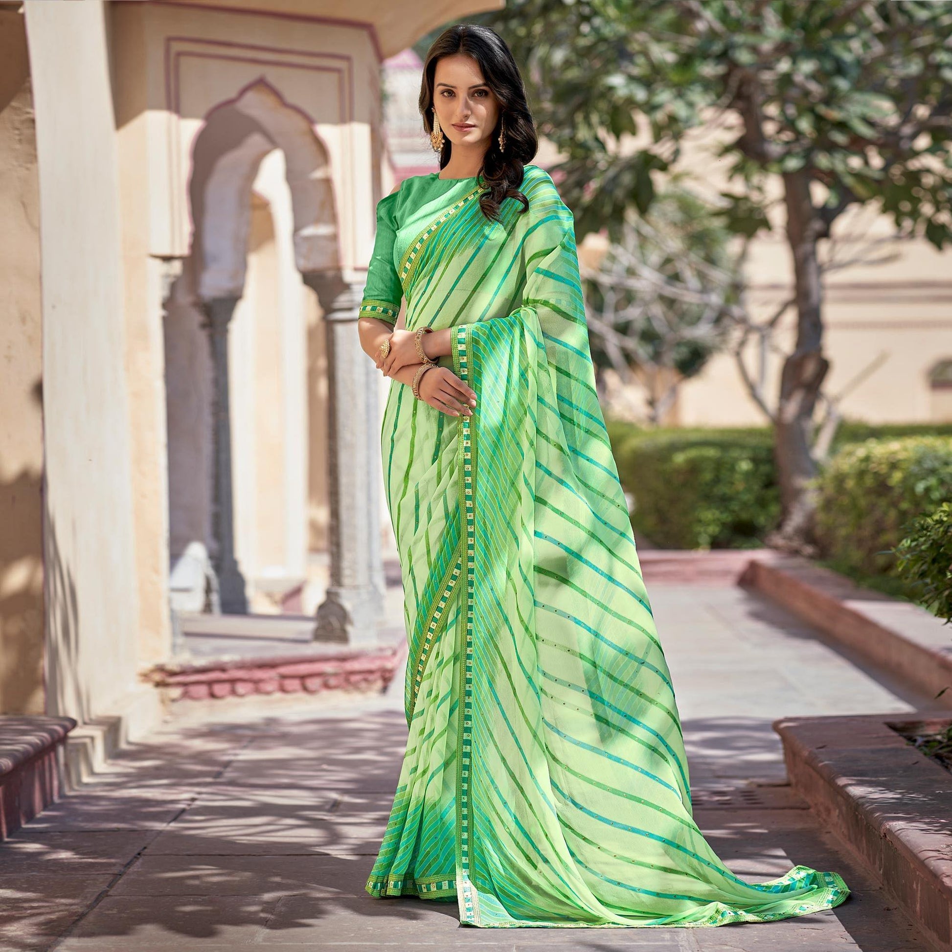 green-printed-with-embellished-georgette-saree-143510