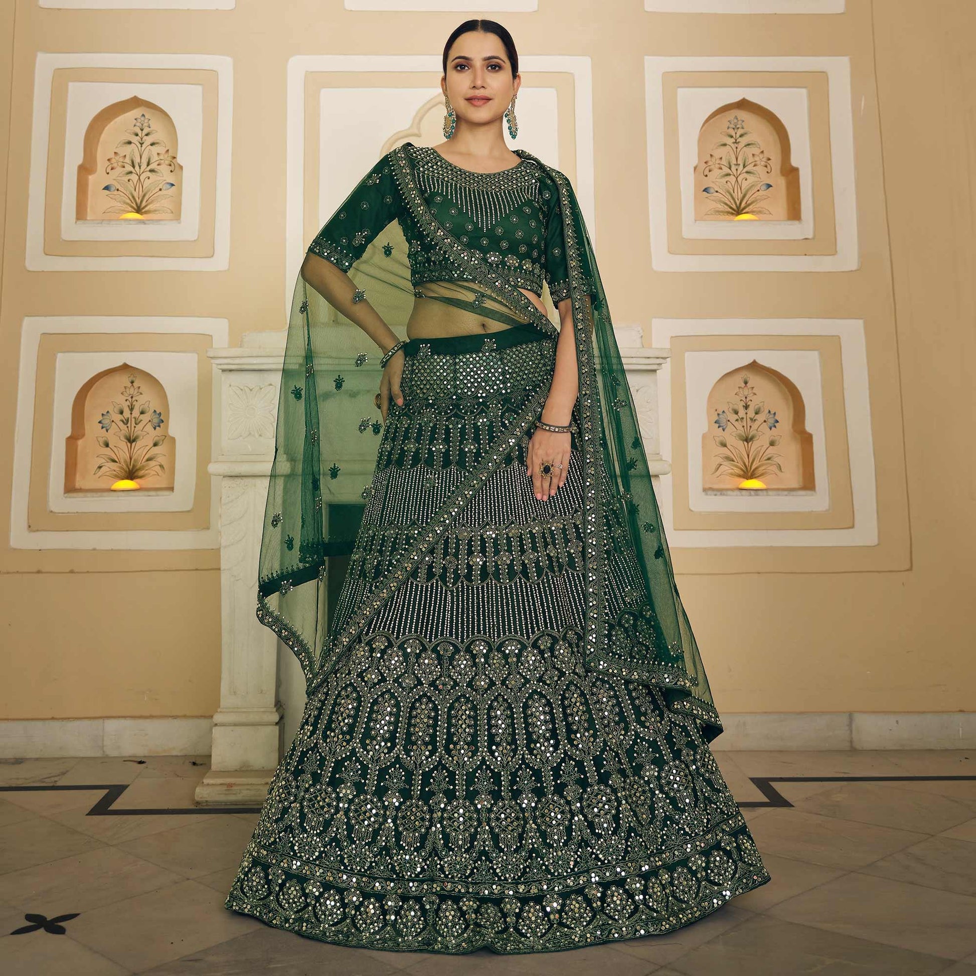 green-wedding-wear-embellished-netted-lehenga-choli-139094