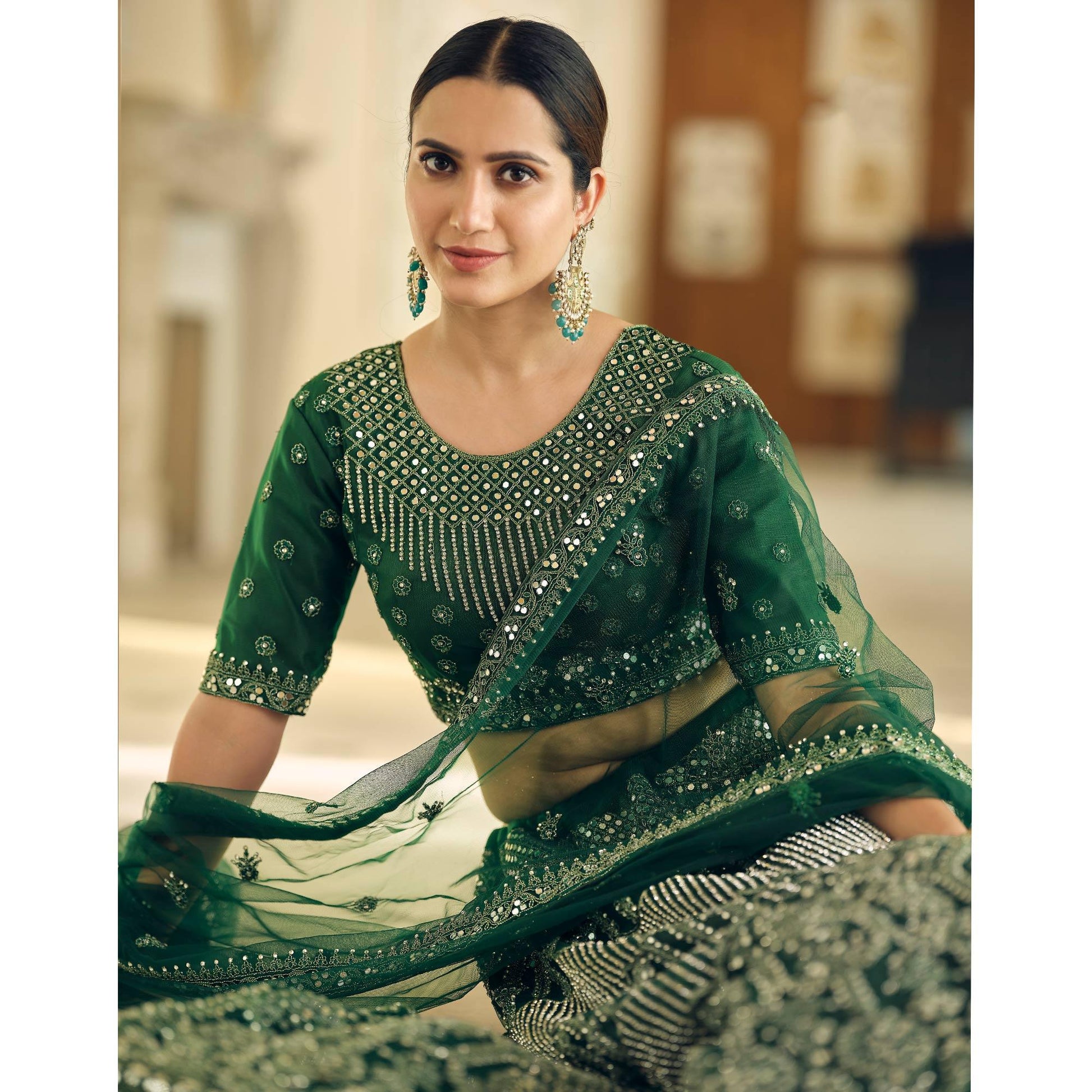 green-wedding-wear-embellished-netted-lehenga-choli-139094