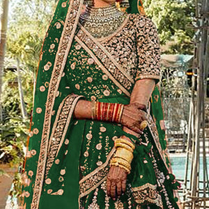 green-wedding-wear-embroidered-with-embellished-velvet-lehenga-choli-139923