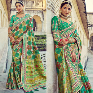 green-wedding-wear-resham-with-embellished-silk-bhandhani-patola-saree-139236