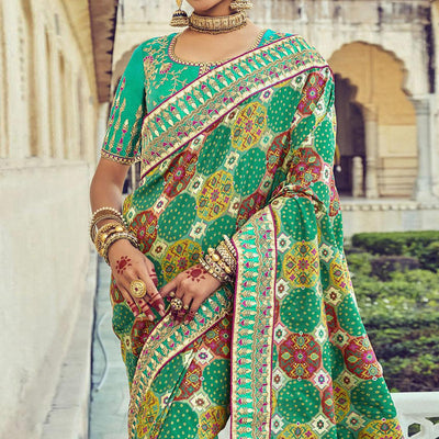 green-wedding-wear-resham-with-embellished-silk-bhandhani-patola-saree-139236