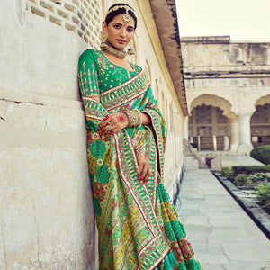 green-wedding-wear-resham-with-embellished-silk-bhandhani-patola-saree-139236