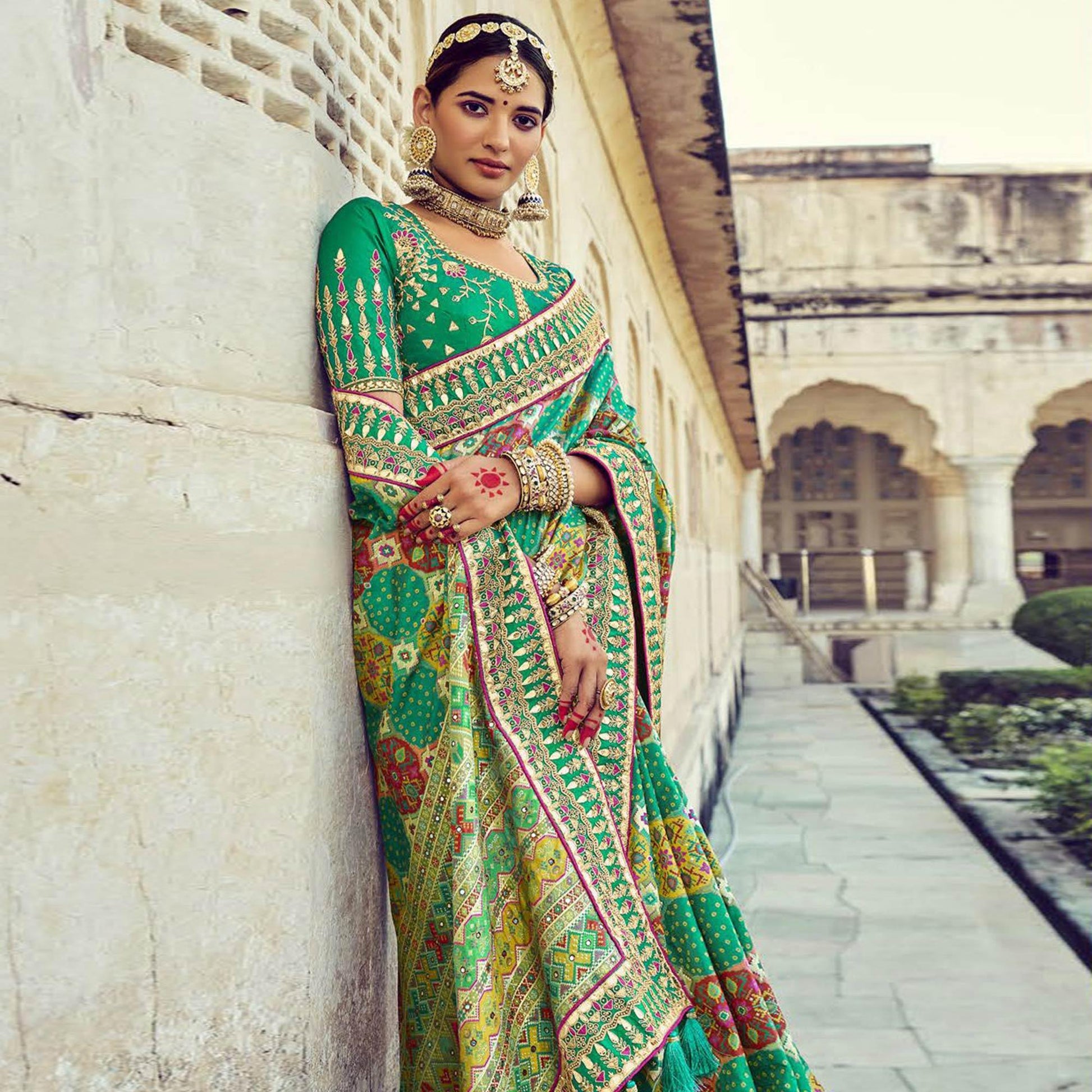 green-wedding-wear-resham-with-embellished-silk-bhandhani-patola-saree-139236