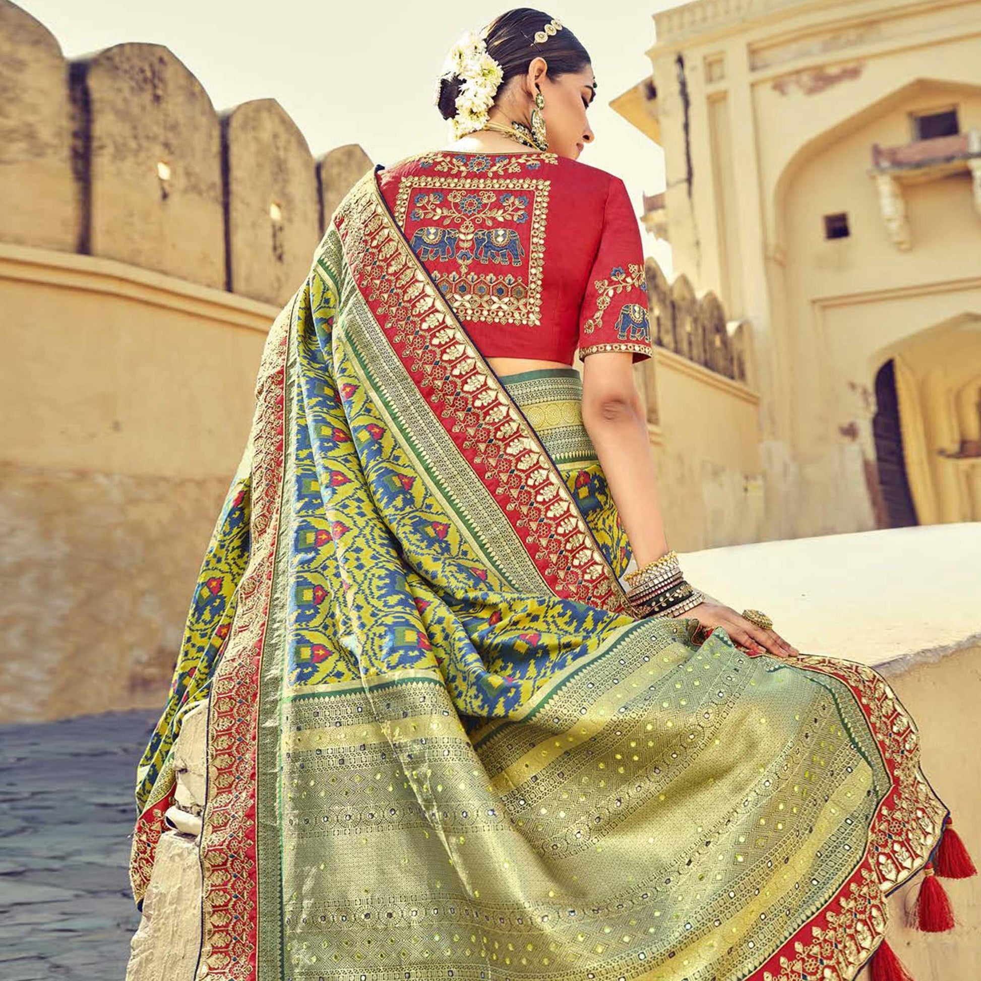 green-wedding-wear-resham-with-embellished-silk-patola-saree-139234