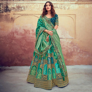 green-wedding-wear-woven-embroidered-silk-lehenga-choli-126743
