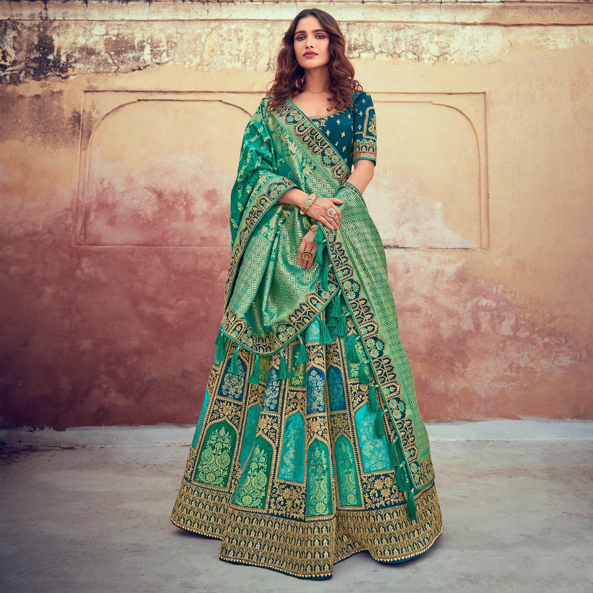 green-wedding-wear-woven-embroidered-silk-lehenga-choli-126743