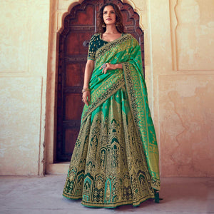 green-wedding-wear-woven-embroidered-silk-lehenga-choli-126744