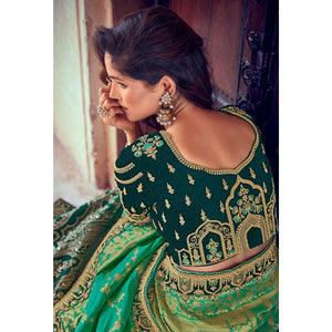 green-wedding-wear-woven-embroidered-silk-lehenga-choli-126744