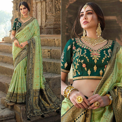 green-festive-wear-woven-silk-saree-with-tassels-138970