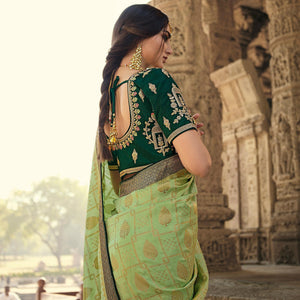 green-festive-wear-woven-silk-saree-with-tassels-138970