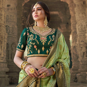 green-festive-wear-woven-silk-saree-with-tassels-138970