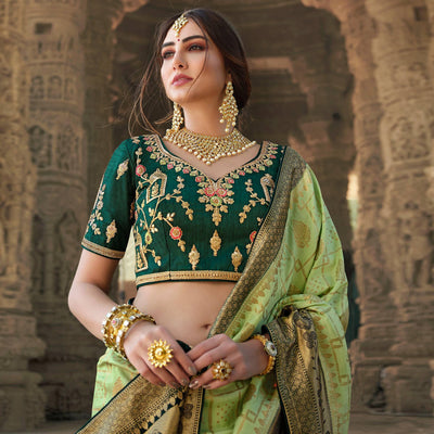green-festive-wear-woven-silk-saree-with-tassels-138970