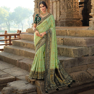 green-festive-wear-woven-silk-saree-with-tassels-138970