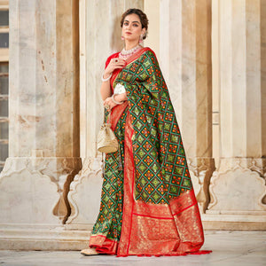 green-woven-art-silk-patola-saree-with-tassels