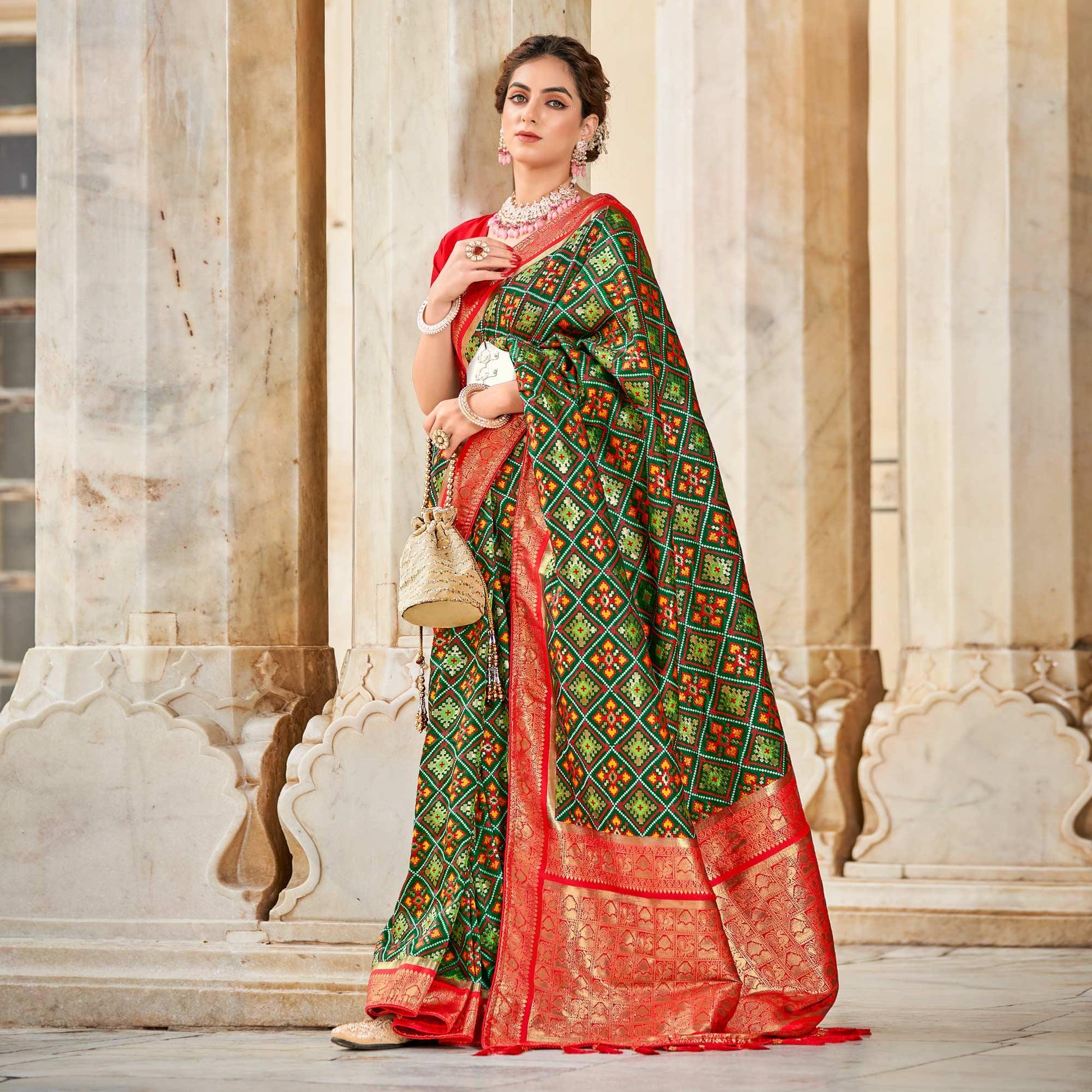 green-woven-art-silk-patola-saree-with-tassels