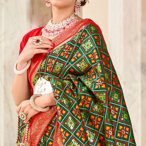 green-woven-art-silk-patola-saree-with-tassels