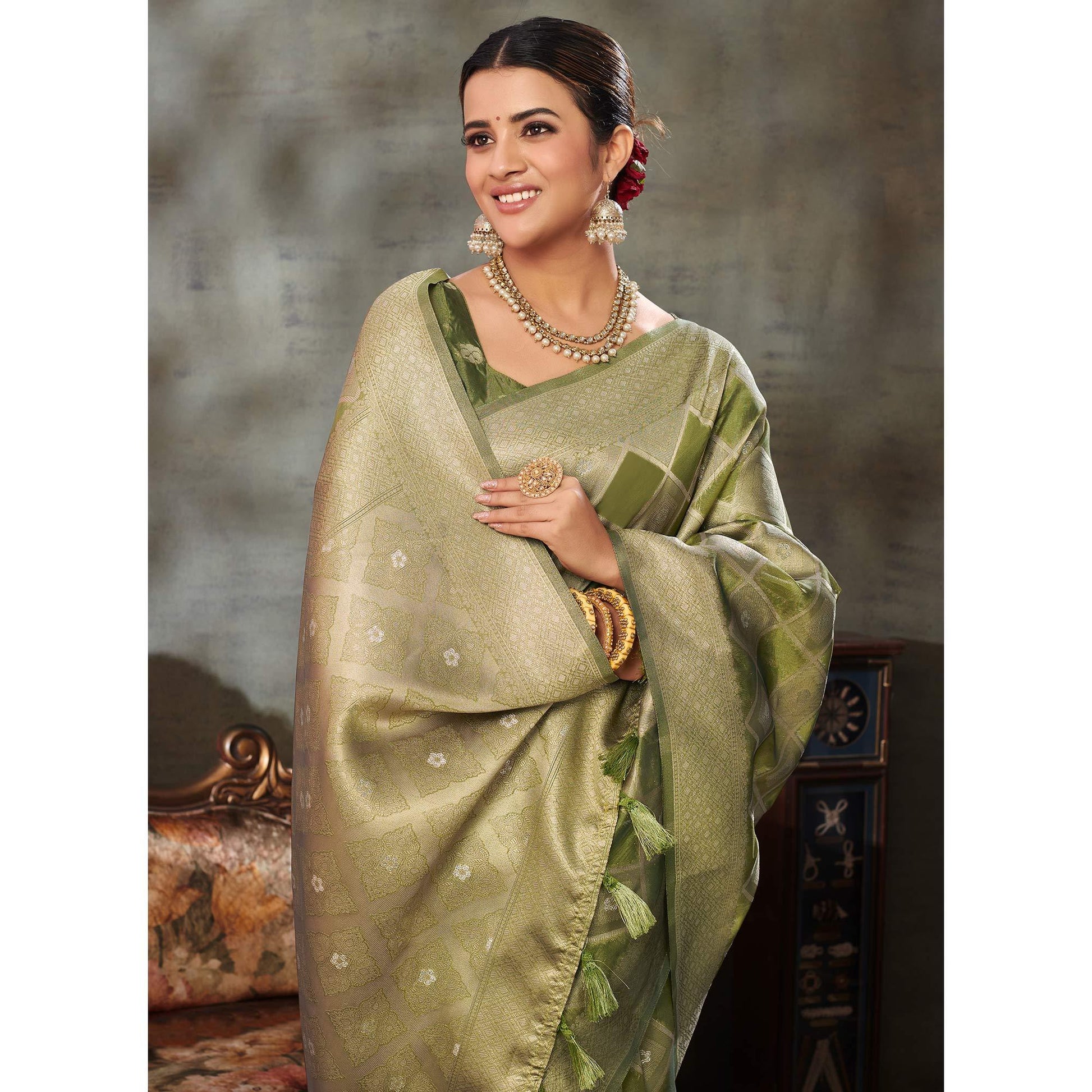 green-woven-organza-saree-with-tassels