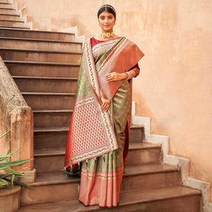 green-woven-silk-saree-with-tassels