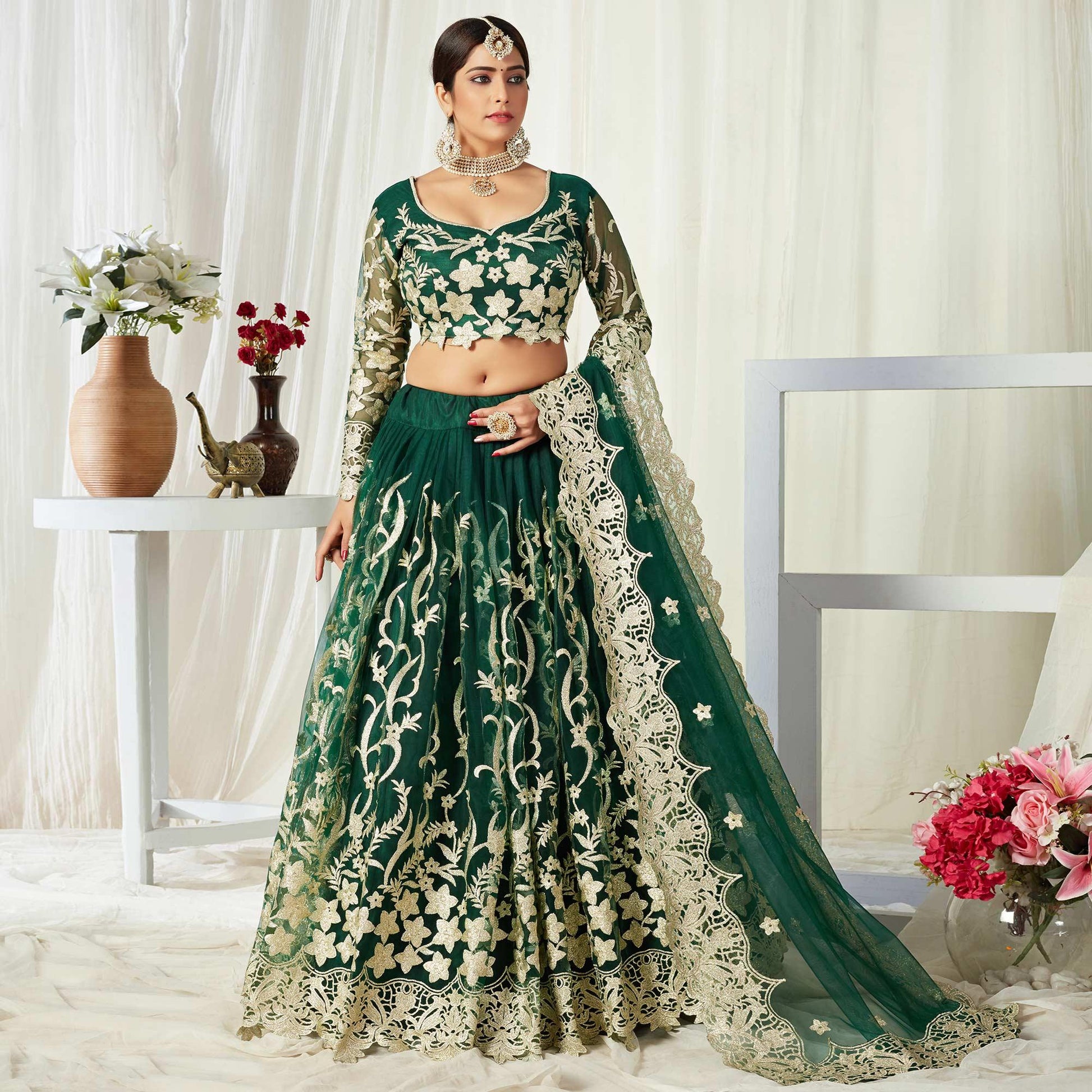 Groovy Dark Green Colored Wedding Wear Butterfly Net With Embroidered Lehenga Choli
