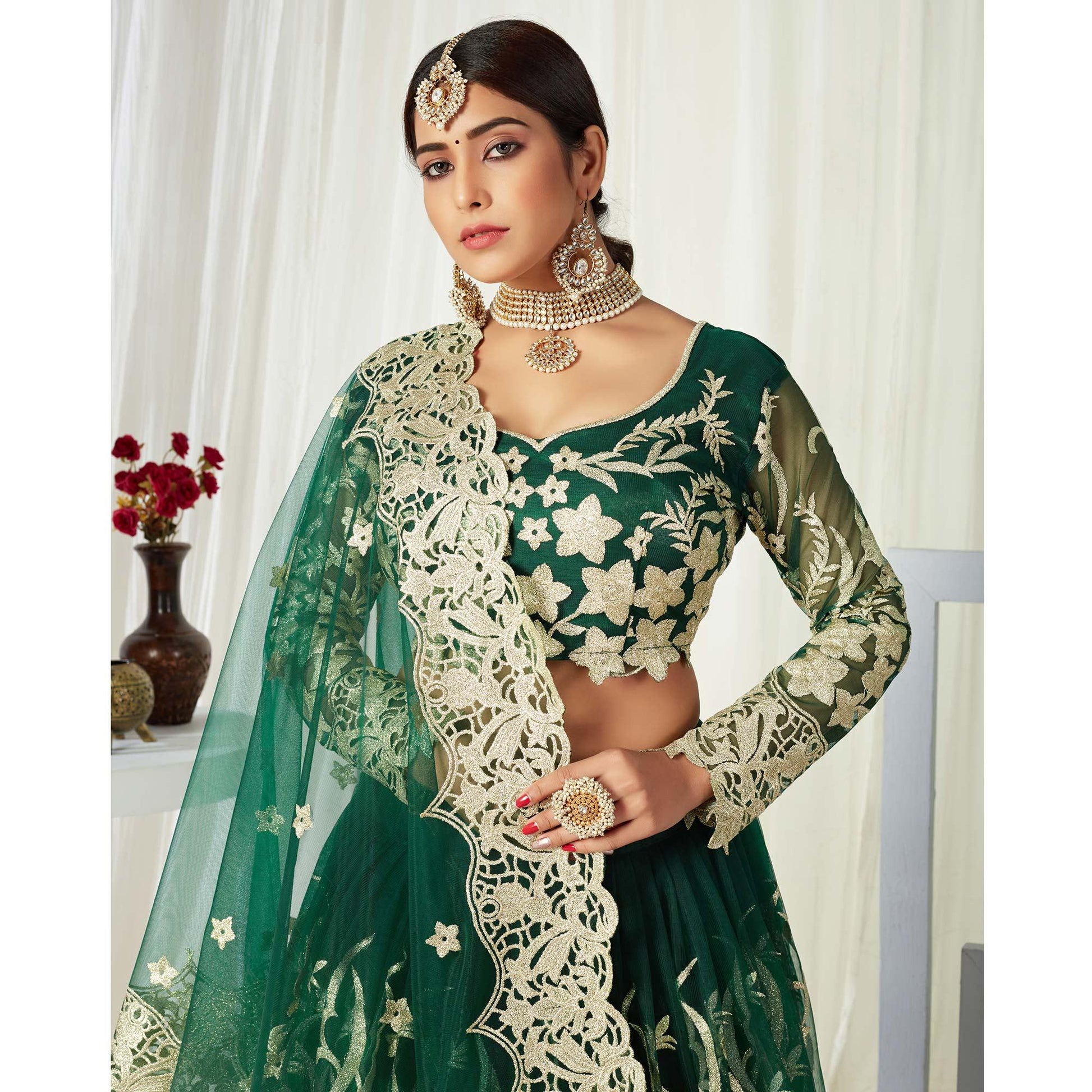 Groovy Dark Green Colored Wedding Wear Butterfly Net With Embroidered Lehenga Choli