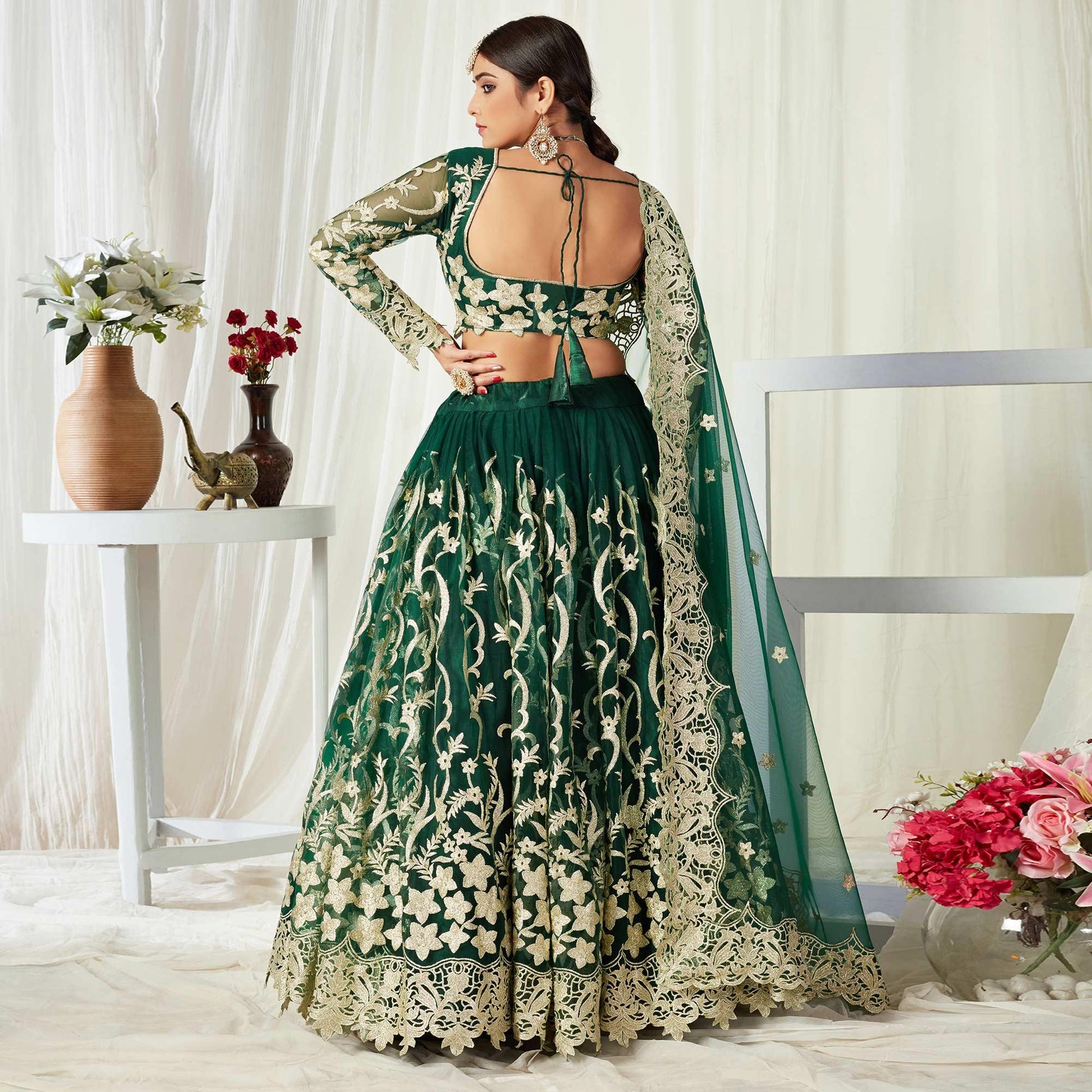 Groovy Dark Green Colored Wedding Wear Butterfly Net With Embroidered Lehenga Choli