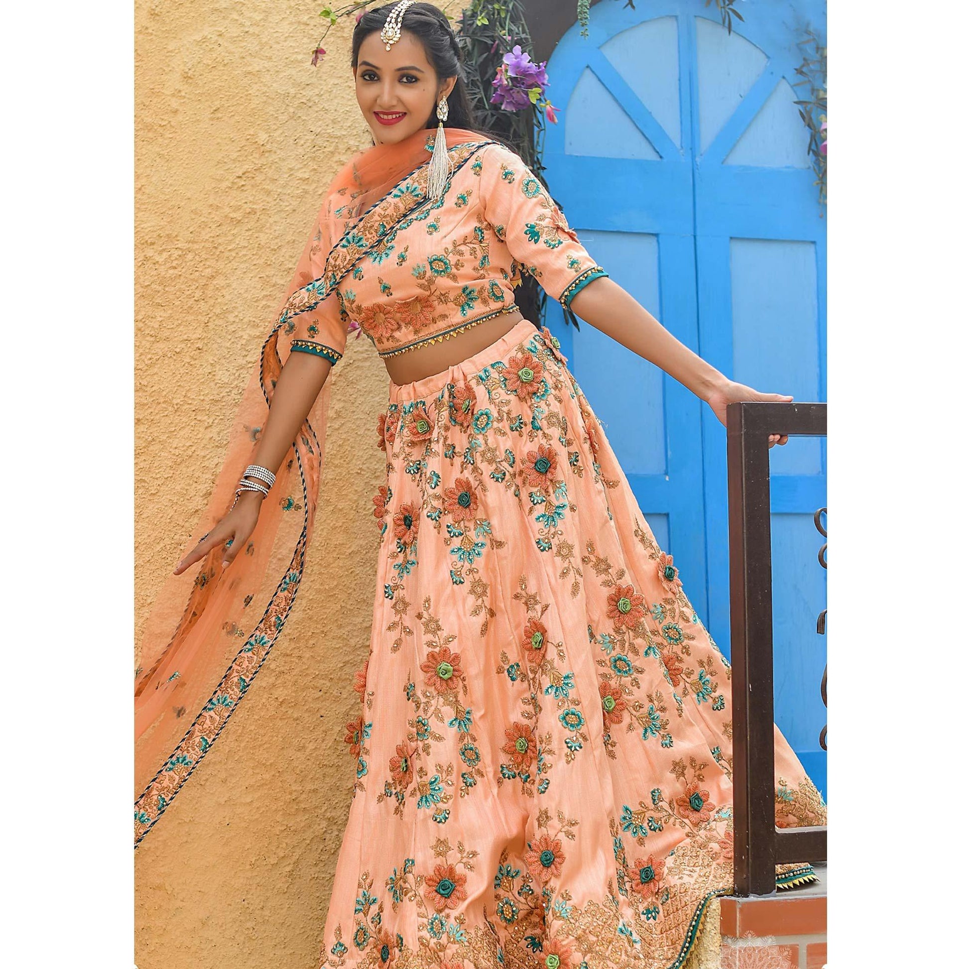 Groovy Peach Colored Partywear Embroidered Silk Lehenga Choli