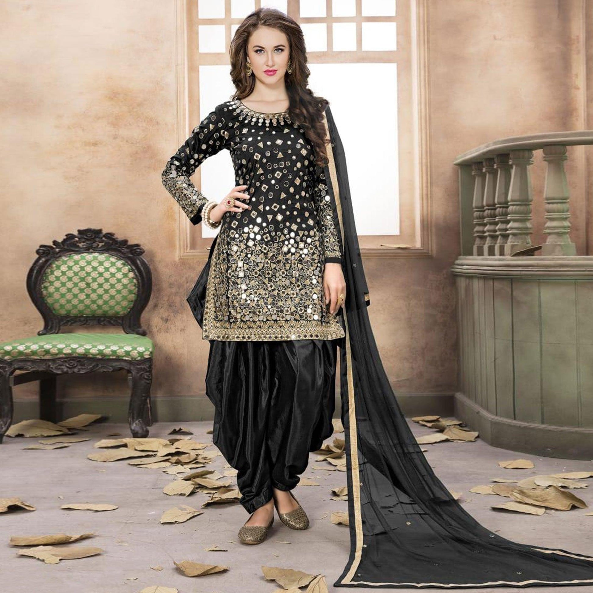 Hypnotic Black Colored Partywear Embroidered Tapeta Silk Patiala Suit