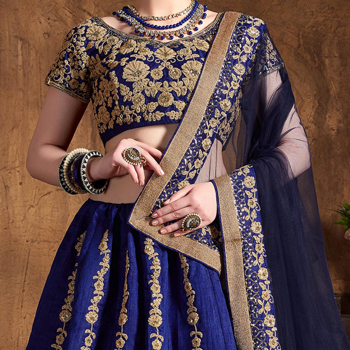 Hypnotic Blue Colored Designer Partywear Raw Silk Lehenga Choli