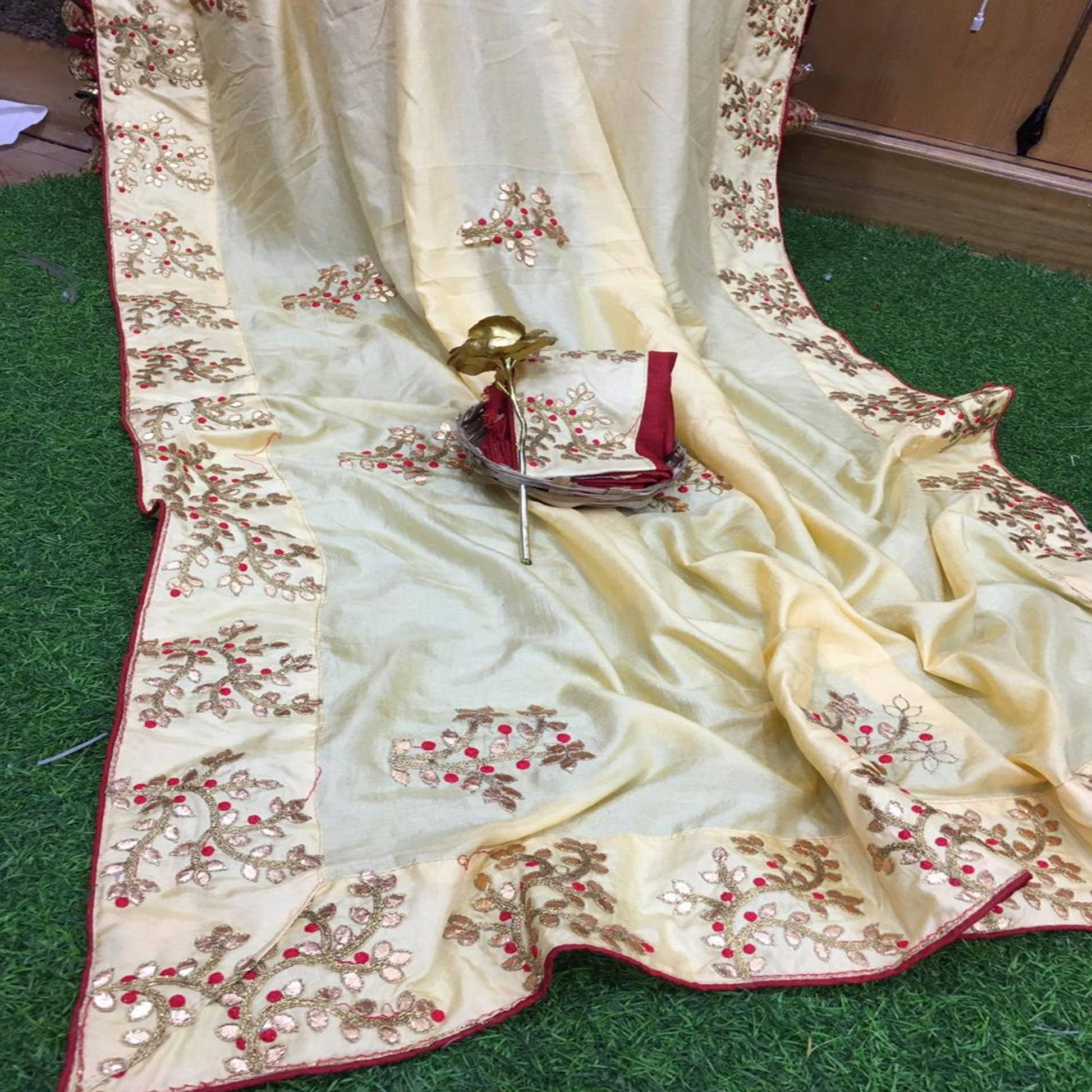 Hypnotic Cream Colored Festive Wear Butta Work Dola Silk Saree